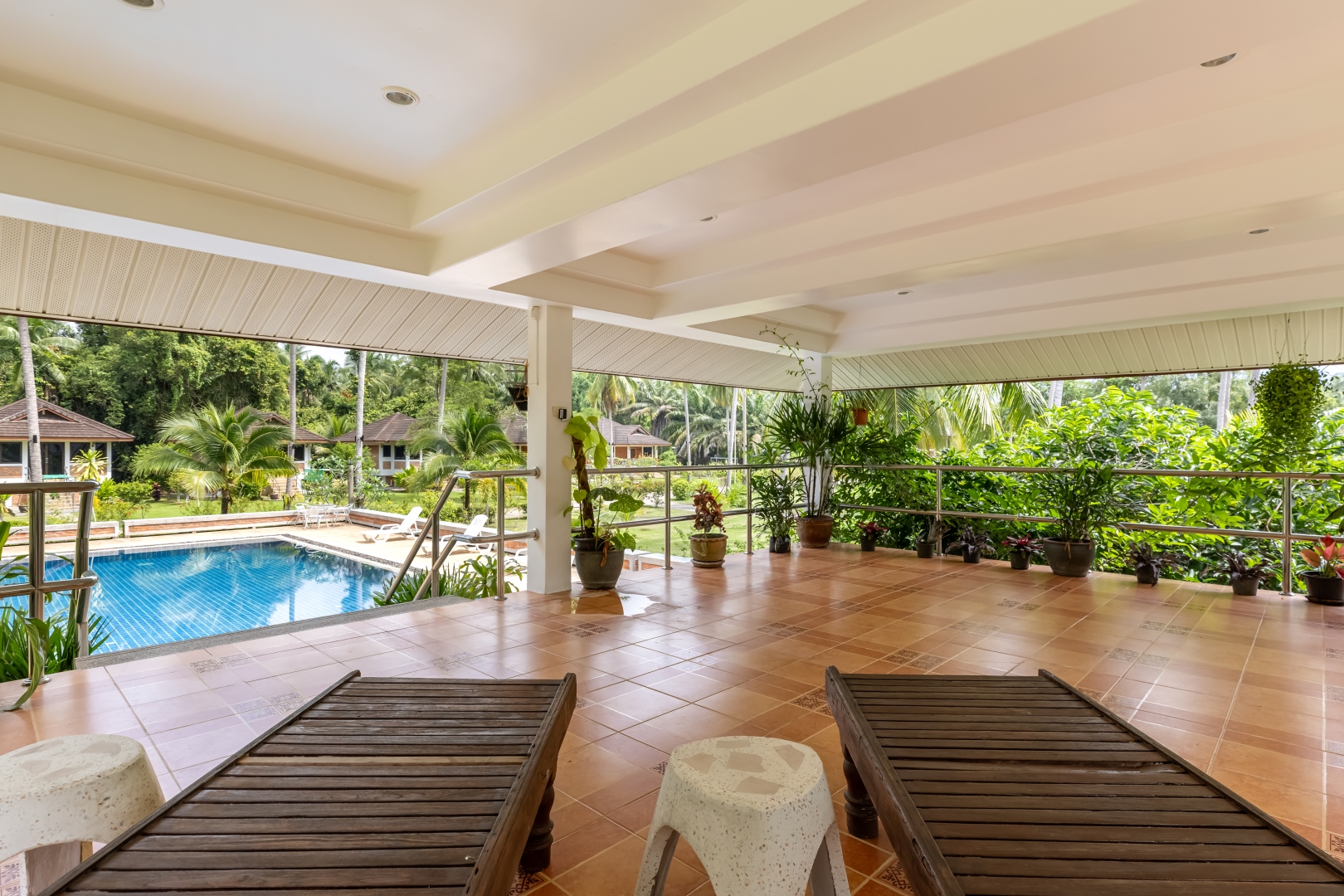 Covered terrace looking out to the swimming pool