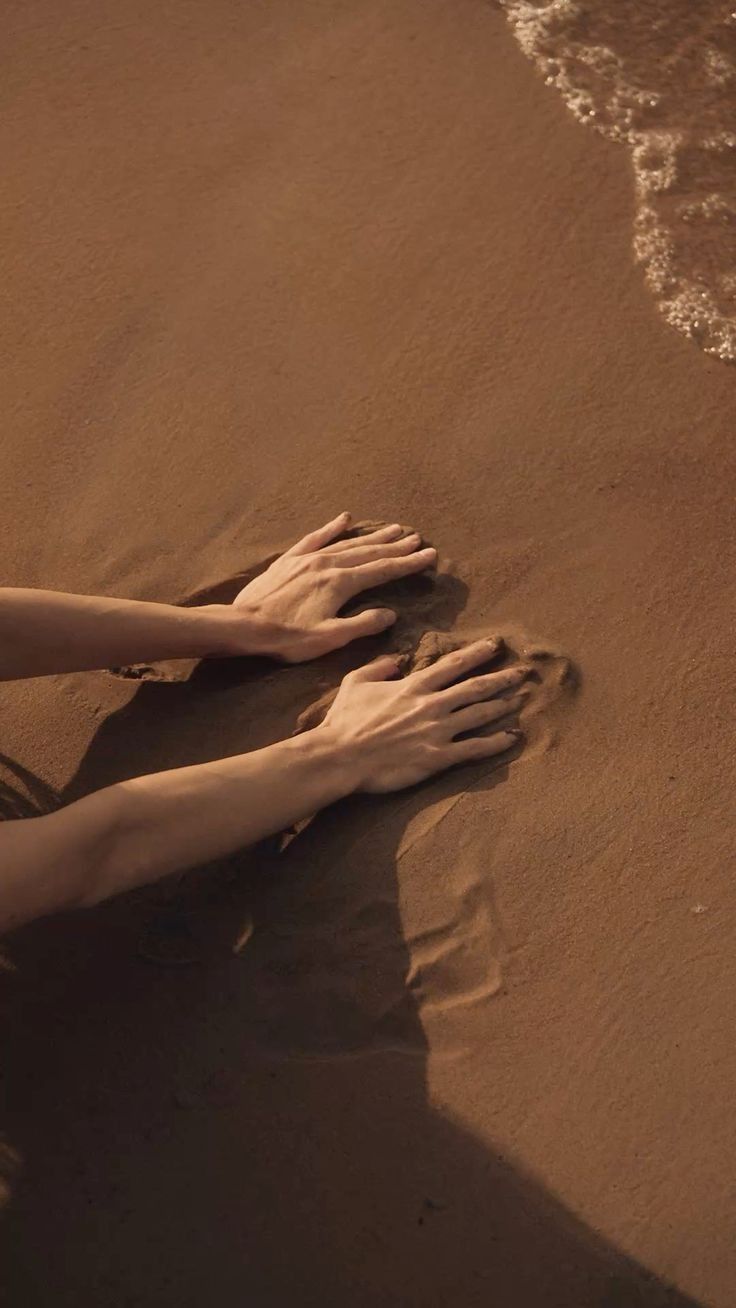 Hands pressed into warm earth